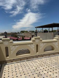 a building with a pattern on the side of it at SILVER Terrace in Bukhara