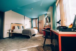 a hotel room with a bed and a desk at Bullitt Hotel in Belfast