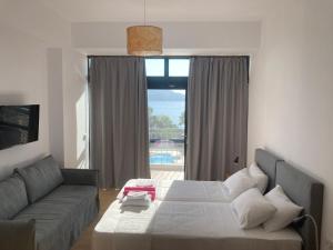Postel nebo postele na pokoji v ubytování Almyra Holiday Village
