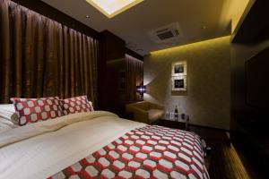 Voodi või voodid majutusasutuse HOTEL GLANZ CASCATA toas
