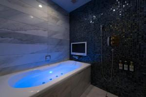 Koupelna v ubytování HOTEL GLANZ CASCATA