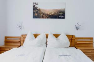 Postel nebo postele na pokoji v ubytování NaturparkResort Haus Geigenkogel