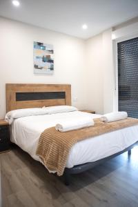 A bed or beds in a room at Casa en Tarela, Porto do Son