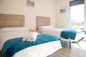 A bed or beds in a room at Casa en Tarela, Porto do Son