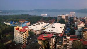 an overhead view of a city with a river and buildings at TreeHouse Neptune Inn in Panaji