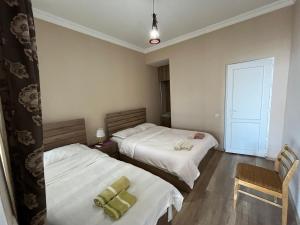 Postelja oz. postelje v sobi nastanitve Guest House Aisi