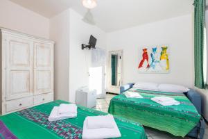 Postel nebo postele na pokoji v ubytování Helios Hotel