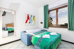 Postel nebo postele na pokoji v ubytování Helios Hotel