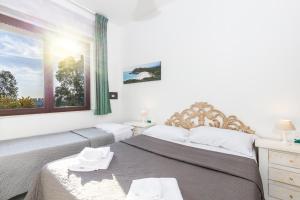 Postel nebo postele na pokoji v ubytování Helios Hotel