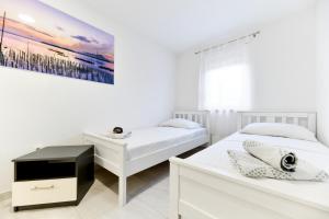 Posteľ alebo postele v izbe v ubytovaní Crowonder Villa Smile with Swimming Pool and Stone Backyard + 26 fotografií