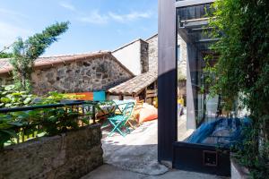 a view of a patio from the outside of a house at La Trêve - Mas 12 personnes rénové avec Piscine in Saint-Julien-du-Serre