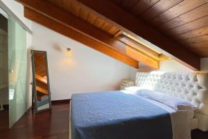 Postel nebo postele na pokoji v ubytování Dreams on the Lake - Affitti Brevi Italia