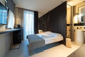 a hotel room with a bed and a sink at B&B Flow in San Benedetto del Tronto