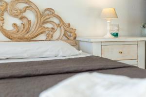 Postel nebo postele na pokoji v ubytování Helios Hotel