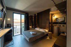 a hotel room with a bed and a large window at B&B Flow in San Benedetto del Tronto