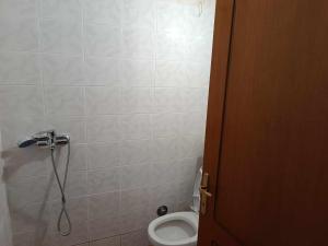 a bathroom with a toilet and a shower at Rainbow Castle Villa neos panteleimonas in Neos Panteleimonas +11 photos