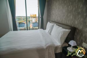 Postel nebo postele na pokoji v ubytování Hotel Serviced Apartments Top One Infinity Pool with View of 360 Degree