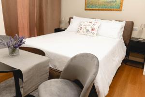 Postel nebo postele na pokoji v ubytování Ayma B&B