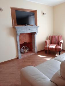 TV a/nebo společenská místnost v ubytování B&B A TAVERNA
