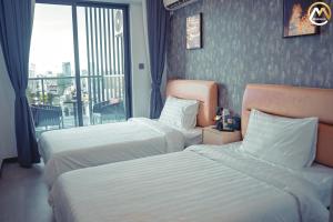 Postel nebo postele na pokoji v ubytování Hotel Serviced Apartments Top One Infinity Pool with View of 360 Degree