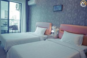 Postel nebo postele na pokoji v ubytování Hotel Serviced Apartments Top One Infinity Pool with View of 360 Degree