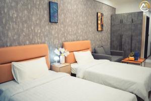 Postel nebo postele na pokoji v ubytování Hotel Serviced Apartments Top One Infinity Pool with View of 360 Degree