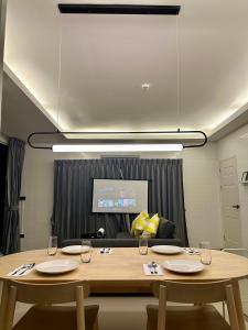 a conference room with two tables and a couch at Cape House in Ban Bang Kaeo +16 photos