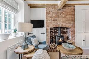 Μια τηλεόραση ή/και κέντρο ψυχαγωγίας στο The Nook with Hot Tub +29 φωτογραφίες