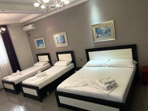 Postel nebo postele na pokoji v ubytování Hotel Erandi