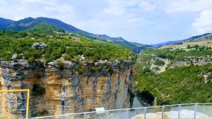 a view of a mountain with a river at Qafoku GuestHouse in Çorovodë +3 photos