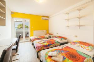 Postel nebo postele na pokoji v ubytování ŠD Portorož Hostel Korotan