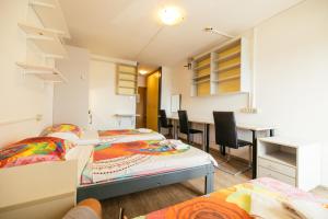 Postel nebo postele na pokoji v ubytování ŠD Portorož Hostel Korotan