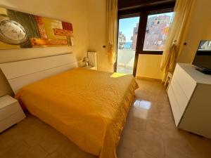 a bedroom with a bed and a large window at Dimora Signore Gallipoli lido in Gallipoli +13 photos