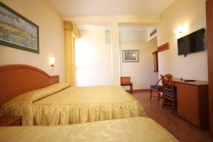 Posteľ alebo postele v izbe v ubytovaní Hotel Katy