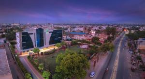 an overhead view of a city at night with a building at Wingston A TreeHouse Hotel, Mathura in Mathura