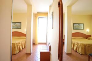 Posteľ alebo postele v izbe v ubytovaní Hotel Katy