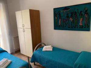 Postel nebo postele na pokoji v ubytování OLIVIA e TETI