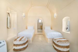 Voodi või voodid majutusasutuse Eolithos Exclusive Suites toas
