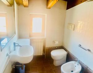 a bathroom with a white toilet and a sink at Residenza La Rotonda in Vasto