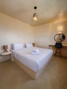 Voodi või voodid majutusasutuse Eolithos Exclusive Suites toas