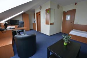 TV a/nebo společenská místnost v ubytování Hotel Nord
