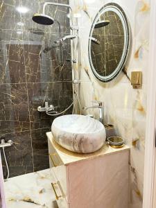a bathroom with a sink and a shower at Dreamsville Chalet Gabala in Gabala +19 photos