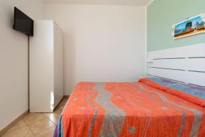 Postel nebo postele na pokoji v ubytování Casa Vacanze Orlando - Con Veranda Vista Mare a 200M dal Mare