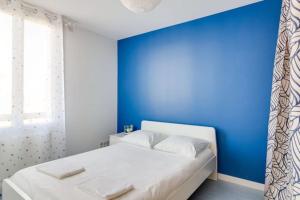 Posteľ alebo postele v izbe v ubytovaní L'Indigo - Les Maisons de Madeleine