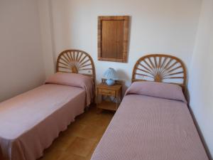 Postel nebo postele na pokoji v ubytování Peñíscola I