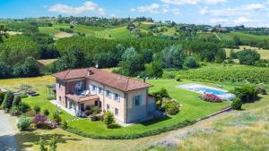 an aerial view of a house with a swimming pool at CASCINA MOGLIA 8&1, Emma Villas in Carpeneto