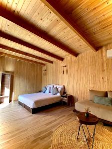 a bedroom with a bed and a couch at Domain The blaze in Marrakesh