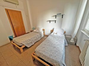 Postel nebo postele na pokoji v ubytování Como City Life