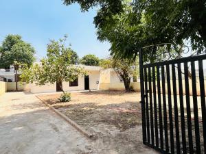 a black gate in front of a house at Comfort Homes in Panchkula