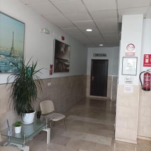 a waiting room with a sign that reads cincinnati at Hostal Carlos 2 in La Línea de la Concepción